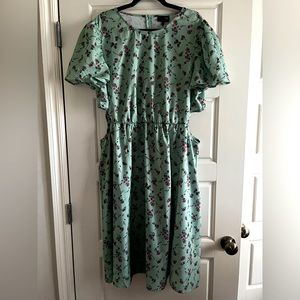 Light green flowered dress with side cut outs